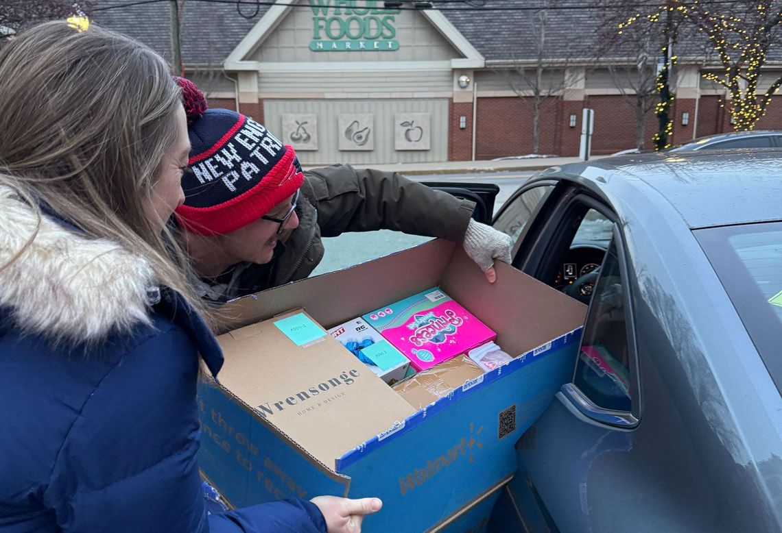 The Connecticut team getting ready to deliver gifts to New Reach in New Haven.